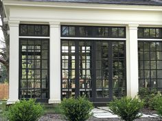 a white house with black doors and windows