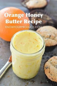 orange honey butter recipe in a glass jar next to muffins and an orange