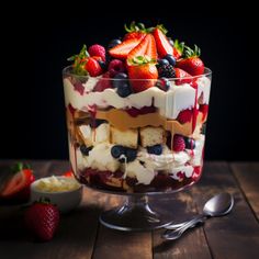 a trifle with strawberries, blueberries and cream