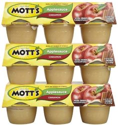 six boxes of mott's appleauce are stacked on top of each other