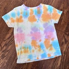 Hanes T-Shirt, Size Xs. My Daughter Tied Dyed This So It Was A White T-Shirt Then She Made It Colorful! Unfortunately She Outgrew It And It Looks Brand New And So Fun! Casual Multicolor Watercolor Print T-shirt, Bleached Multicolor Graphic Tee, Casual Multicolor Soft-washed T-shirt, Casual Cotton T-shirt With Watercolor Print, Casual Tie Dye Top With Watercolor Print, Casual Tie Dye Watercolor Print Top, Casual Multicolor Washed Tops, White Hand-dyed Short Sleeve Tops, Multicolor Bleached Crew Neck Top