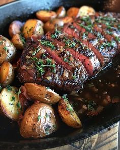 steak and potatoes in a cast iron skillet