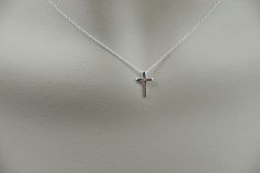 This pretty all sterling silver necklace feature trendy tiny Cross is on a fine Sterling Silver Chain. Sterling Silver Chain, cross and all material made out of 925 sterling silver. This is a great necklace for everyday wear as well as special occasions! Come in a gift box ready as a gift or keep. Cross set in the middle. Cross Size: 11mm x 7mm Necklace: 18 inches stamp .925 This Item is ready to ship within 24hrs. Necklace For Everyday, Silver Cross Necklace, Heavy Earrings, Tiny Cross, Necklace Cross, Jewelry Simple, Square Stud, Cross Jewelry, Cartilage Earrings