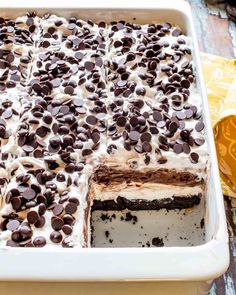 a cake in a pan with chocolate chips on top