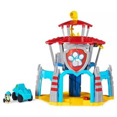 a toy playset with cars and a tower