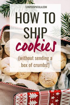 a basket filled with cookies sitting on top of a table next to a christmas tree