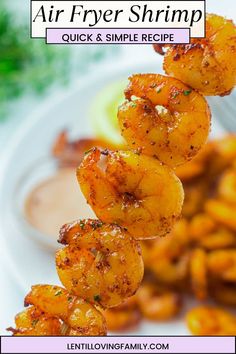 Air fryer shrimp on a skewer served with dipping sauce.