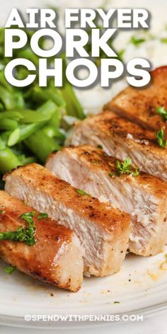 air fryer pork chops on a plate with green beans