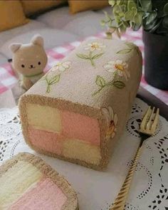 a piece of cake sitting on top of a table next to a fork and knife