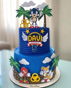 a sonic the hedgehog themed birthday cake with palm trees and other decorations on top