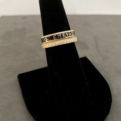 A slim stackable version of our Equus Enamel Ring. Beautiful combination of black enamel and 18 karat yellow gold. 4mm wide Equus (Latin for horse) Cheval (French for horse), stars and a snaffle bit in a continual pattern. Fine beaded detail on both edges. Absolutely gorgeous stacked with the Slim Lace Rein & Diamond Stack rings! Create your own combination! Hand made in the US Made to order, please allow 4-6 weeks for delivery. Luxury Gold Engraved Enamel Ring, Luxury Engraved Gold Enamel Ring, Luxury Black Stackable Rings For Anniversary, Luxury Engraved Yellow Gold Enamel Ring, Luxury 14k Gold Black Enamel Ring, Elegant Yellow Gold Enamel Stackable Rings, Elegant Gold Enamel Stackable Rings, Elegant Gold Stackable Enamel Rings, Elegant Gold Stackable Rings With Enamel