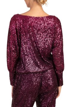 Take your look to glam new heights with this dolman-sleeve top covered in shimmery sequins. Boat neck Long sleeves 95% polyester, 5% spandex Dry clean Imported Pink Contrast Sequin Top For Night Out, Pink Sequin Top For Night Out, Pink Glamorous Top With Contrast Sequin, Pink Glamorous Tops With Contrast Sequin, Glamorous Pink Top With Contrast Sequin, Pink Sequined Tops For Party Season, Glamorous Pink Tops For Fall, Glamorous Pink Fall Tops, Pink Sequined Tops For Fall