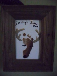 a handprint in a frame with the words daddy's dear on it