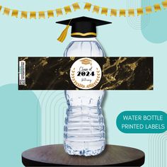 a water bottle label with a graduation cap on it