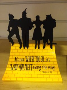 there is a yellow sign with some silhouettes on it that says it's not where you go, it's who you meet along the way