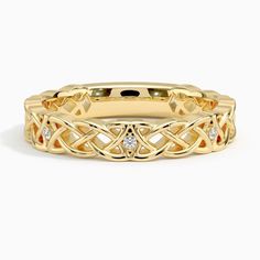 a yellow gold ring with an intricate design