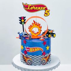 a birthday cake with hot wheels on top and a sign that says, forever 5