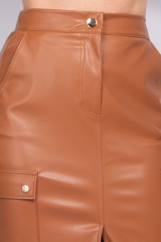 Make a bold statement with our Faux Leather High-Rise Cargo Skirt, a chic addition to the trendy minimalism movement. Its high-rise waist and zip-fly button closure provide a smooth and flattering fit, while side pockets offer practicality without sacrificing style. The front slit adds a touch of allure to the midi-length design, creating a versatile piece that's both edgy and elegant.Key Features:- Fabric: Crafted from 60% Rayon and 40% Polyester for a luxurious feel and durability.- Fit: Desig Blue Zones, Activewear Sets, Cargo Skirt, Fleece Joggers, Skirt Leggings, Tee Dress, Spaghetti Strap Dresses, Sport T Shirt, Edgy Fashion