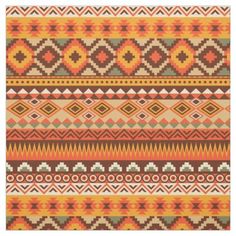 an orange and yellow rug with different patterns