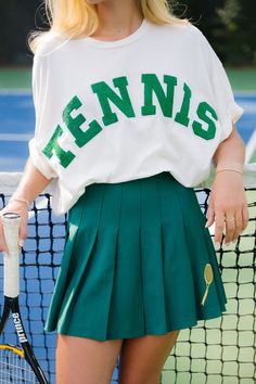 The SINGLES TENNIS TEE is for the tennis pro who loves an oversized tee! Product details: Oversized tee Wide body style Hand wash only Model  is 5’8" and is wearing a size small.  Measurements: SMALL MEDIUM LARGE X-LARGE Length 23" 23" 24" 24" Bust 50” 52" 54" 56" Hips 50” 52”" 54" 56" This is a made-to-order item. All Tennis Style Outfit, Cloud Clothes, Sports Wear Outfits, Tennis Lifestyle, Mom Uniform, Green Pleated Skirt, Tennis Outfits, Tennis Outfit Women, Tennis Style