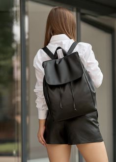 Chic and stylish black eco leather backpack is a must-have accessory, designed to accommodate all your essentials in style. Whether you're a college student, working professional, or city dweller, this versatile shoulder bag is perfect for any occasion. With ample storage space and a sleek design, it's the ideal choice for carrying your laptop, school supplies, work essentials, and more. Upgrade your college essentials with this sophisticated woman's backpack that combines practicality and fashion effortlessly. Stay organized and trendy with this small city backpack that will surely become your go-to everyday bag. Backpack made of eco-leather. There are one big compartment, two smaller pockets and one pocket with zipper inside backpack. Big compartment perfectly suited for laptop or notebo Elegant Backpack School Bags, Everyday Backpack Women, Trendy Faux Leather Backpack For School, Casual Faux Leather Backpack For School, Casual Faux Leather School Backpack, Black Faux Leather Backpack For School, Black Faux Leather Trendy Backpack, Trendy Black Faux Leather Backpack, Trendy Leather Backpack For Travel And Back To School