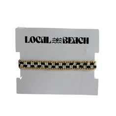 Local Beach Checker Beaded Bracelets Adjustable glass cotton cord beaded bracelets 1/4 in wide Wear Alone or Layered One Size Fits Most Adjustable Length: 6.5in-10in opening Local Beach Metal Logo Tag Inquire at info@localbeach.com for Wholesale Opportunities Adjustable Round Beads Choker For Beach, Adjustable Gold Stretch Bracelet For Vacation, Black Beaded Bracelets For Beach, Adjustable Beaded Wrap Bracelet For Beach, Black Beaded Beach Choker, Adjustable Round Beads Choker For Vacation, Adjustable Black Beads Jewelry For Beach, Adjustable Black Beaded Jewelry For Beach, Black Beaded Choker For Beach