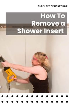 a woman is using a power drill to remove a shower inserter from the wall