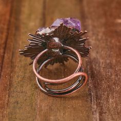 Immerse yourself in the allure of our Vintage Look Bronze Plated Adjustable Ring adorned with Natural Amethyst Crystals. Each ring is a unique masterpiece, with crystal sizes ranging from 21-25x14-16mm, creating a captivating vintage look. With a length of 32x39mm and a weight of 20g, this ring is a perfect blend of sophistication and style. Key Features: Vintage Look Design: The bronze-plated ring exudes a timeless aesthetic, reminiscent of vintage elegance. Natural Amethyst Crystals: Adorn you Adjustable Mystical Crystal Ring, Handmade Adjustable Mystical Crystal Ring, Vintage Amethyst Crystal Ring With Gemstone Detail, Vintage Amethyst Jewelry For Healing, Vintage Amethyst Crystal Ring With Gemstone, Unique Adjustable Amethyst Jewelry, Vintage Amethyst Crystal Ring As Gift, Vintage Amethyst Crystal Ring Gift, Vintage Amethyst Crystal Ring For Gift