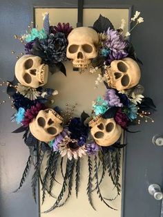 a wreath decorated with skulls and flowers