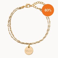 Available in a range of striking colours, our beautifully handwoven Personalized Braided Chain Bracelet is the perfect mix of sentiment and style, hand-engraved with your own special words.Available in 18K Champagne Gold PlatedAdjustable chain from 5.5 to 7Charm: 10mm diameter, 0.5mm thicknessSecure clasp fasteningCharm can't be removed from this chainHand-engraved in our Paris workshopSent with love in a complimentary gift boxAny slight variations in lettering depth, spacing and alignment from the examples shown are part of the aesthetic and originality of the piece. Adjustable Yellow Gold Name Bracelet, Personalized Adjustable Gold Braided Bracelets, Personalized Adjustable Gold Braided Bracelet, Elegant Personalized Gold Friendship Bracelets, Gold Braided Bracelet With Adjustable Chain As A Gift, Adjustable Yellow Gold Braided Bracelet With Jubilee Detail, Adjustable Yellow Gold Chain Bracelet For Friendship, Adjustable Engraved Yellow Gold Charm Bracelet, Gold Bracelets With Engraving Option For Friendship