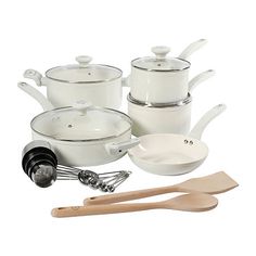 white cookware set with wooden utensils and spatulas on the side