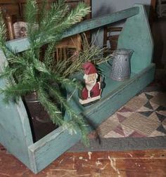 a potted plant sitting on top of a wooden bench