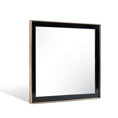 a black and gold framed mirror on a white background with the reflection of it's own image