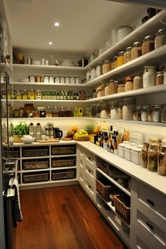 a kitchen with lots of shelves filled with food