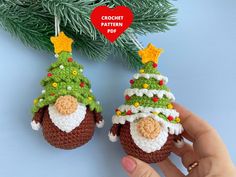 two crocheted christmas ornaments hanging from a tree