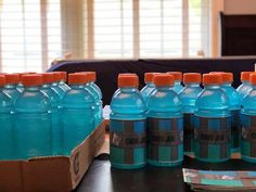 several bottles of bottled water sitting on a table