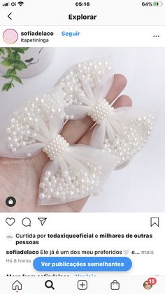 someone is holding a small white bow with pearls on the side and text that reads,