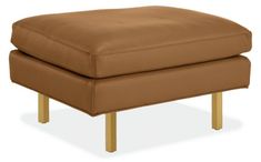 a brown ottoman with wooden legs on an isolated white background