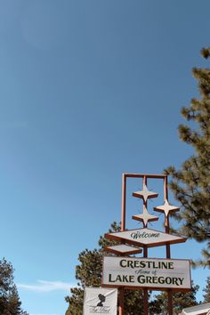 a sign for crestline lake greigovy and welcome to the town