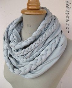 a mannequin wearing a light blue scarf