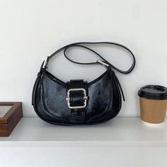 Introducing the Crescent Baguette Bag - a classic vegan leather bag with a timeless aesthetic featuring a magnetic buckle clasp, zip closure, and adjustable strap. It's the perfect accessory for any outfit - day or night! (And no, it's not actually made from bread.) 🥖✨ Dimensions: 26X14X7 CM Classic Baguette Bag With Adjustable Handle For Everyday Use, Vintage Baguette Bag With Adjustable Strap, Retro Leather Baguette Bag For Everyday, Classic Baguette Bag With Hasp Closure For Everyday, Retro Baguette Bag With Adjustable Strap For Daily Use, Baguette Shoulder Bag With Detachable Strap For Everyday Use, Classic Baguette Bag With Adjustable Strap, Retro Satchel Baguette Bag With Detachable Strap, Classic Baguette Bag For Everyday Use