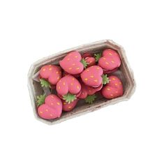 a container filled with pink and yellow strawberries