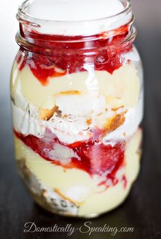 a glass jar filled with food sitting on top of a table