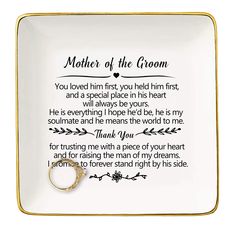 a plate with a wedding ring on it that says,'mother of the groom '