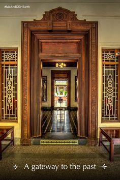 the entrance to a building with an ornate door and benches on either side that lead into another room