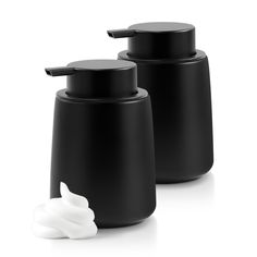 two black and white containers sitting next to each other