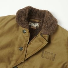 The N-1 deck jacket has cemented its place in history as one of the most versatile and classically cool garments ever produced for the military. Many companies have produced their own version of this sartorial icon, but few have come as close to the originals as Buzz Rickson’s. With a keen eye for quality and attention to detail, the brand have accurately reproduced these jackets to be as close to those issued by the U.S Navy as they can be. The classic standard fit of the N-1 has been cut from N1 Deck Jacket, Buzz Rickson, Deck Jacket, Khaki Colour, American Casual, Workwear Jacket, U S Navy, Vintage Military, Mens Style