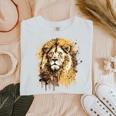 Unleash your inner strength with this "Lion" graphic T-shirt, featuring a bold and majestic lion design that embodies courage, power, and leadership. Whether you're an animal lover, a fan of wildlife, or simply drawn to the symbolism of the king of the jungle, this shirt is the perfect way to showcase your fierce side. Made with premium quality, soft cotton fabric, this T-shirt offers both style and comfort, ideal for everyday wear. Let the lion's roar be your inspiration, reminding you to stay strong and fearless in everything you do. Key Features High-quality, comfortable cotton fabric Majestic lion graphic design Perfect for animal lovers, wildlife enthusiasts, and lion fans Available in various sizes and colors Makes a great gift for those who embody strength and courage Lion Graphic, Majestic Lion, Lion Design, Trendy Tee, Animal Shirts, Inner Strength, Gifts For Pet Lovers, Gift For Him, Comfort Colors