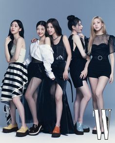 the girls are posing together in black and white outfits for w magazine's cover shoot