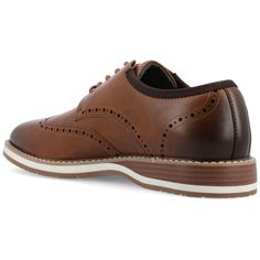 Introducing the Ozzy derby by Vance Co. These classic shoes are made with high-quality vegan leather, offering a professional and timeless style. With a comfortable 12 mm Tru Comfort Foam™ insole and a lace-up design, they provide all-day comfort and a secure fit. The 1-inch block heel, round-toe shape, and wingtip detailing add a touch of sophistication to the Ozzy derby, making it a versatile and stylish choice Brown Synthetic Dress Shoes For Business, Brown Synthetic Dress Shoes For Formal, Brown Synthetic Dress Shoes For Formal Occasions, Brown Synthetic Dress Shoes For Formal Events, Synthetic Brogue Oxfords With Plain Toe, Brown Wingtip Oxfords For Work, Brown Synthetic Oxfords With Rubber Sole, Classic Synthetic Wingtip Oxfords, Synthetic Plain Toe Oxfords With Brogue Detailing